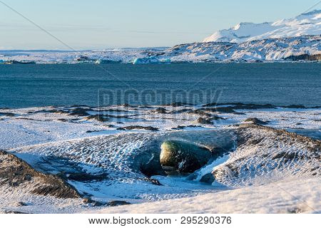 Ice Cave At Sunrise In Breiðamerkurjökull Glacier, Iceland In Winter