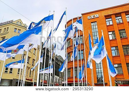 Riga, Latvia - August 28, 2018: The Building Of Seb Bank On The Street Kalku And Flags Of Riga City