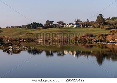 Farm House And Vegetation Around Clifden Bay