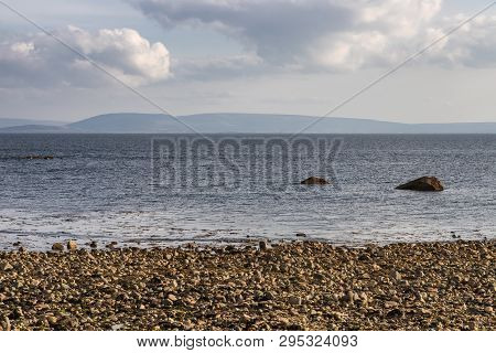 Beach With Rocks And Vegetation In Galway Bay