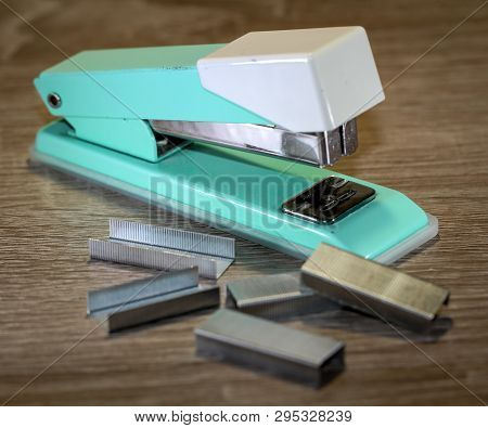 An Old Green Tacker With Spare Cramps