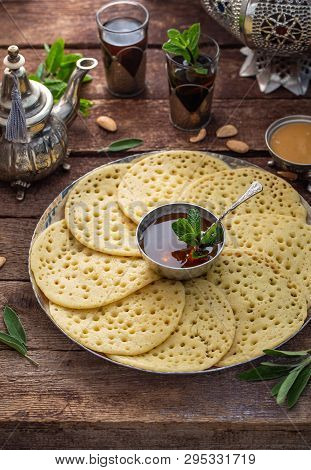 Moroccan Pancakes Baghrir Served With Almond Paste, Honey And Mint Tea