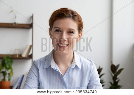 Happy Businesswoman Talking By Video Conference Call Looking At Webcam