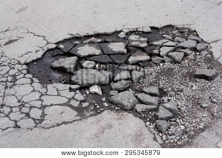 Bad Roads. Repair Asphalt Road. Destruction Of The Roadway. Destruction Of Roads