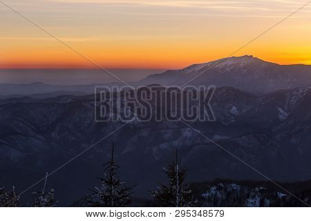 Buila-vanturarita Mountain Seen From Cozia Mountain At Dusk During Winter