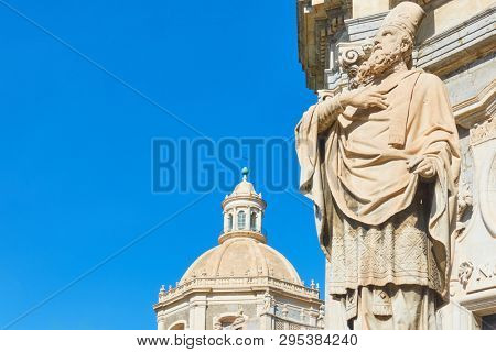 Saint James statue in the front of Saint Agatha Cathedral of Catania and the blue sky, Sicily, Italy. Copyspace composition