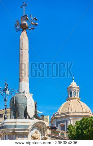 Black elpehant with obelisk on its back in Piazza del Duomo in Catania - symbol of the city of Catania. Sicily, Italy. Created by the architect Giovanni Battista Vaccarini around the 1736