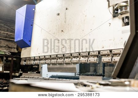 White screen of large industrial machine part inside contemporary machinebuilding plant