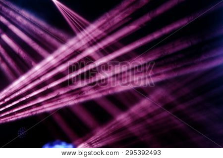 Stage Lights. Several Projectors In The Dark. Multi-colored Light Beams From The Stage Spotlights On