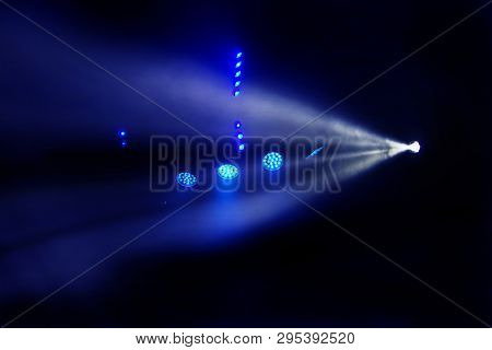 Stage Lights. Several Projectors In The Dark. Multi-colored Light Beams From The Stage Spotlights On