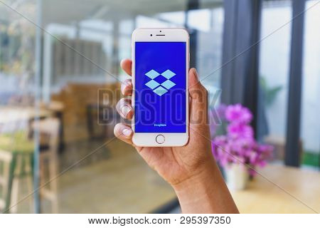 Chiang Mai, Thailand - Mar 02,2018: Man Holding Apple Iphone 6s Rose Gold With Dropbox On Screen. Dr