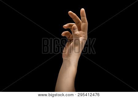 Touching Of Light. Male Hand Demonstrating A Gesture Of Getting Touch Isolated On Black Studio Backg