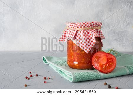 Vegetable Sauce Adjika With Tomatoes, Garlic, Bell Peppers In Jar.