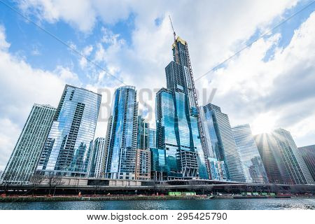 Modern Tower Buildings Or Skyscrapers In Business District, Reflection Of Cloud On Sunny Day In Chic