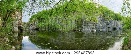 Plain River In Canyon With Steep Rocky Edges In Springtime. Panoramic View Of The Section Of The Buk