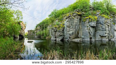 Plain River In Canyon With Steep Rocky Edges In Springtime. Panoramic View Of The Section Of The Buk