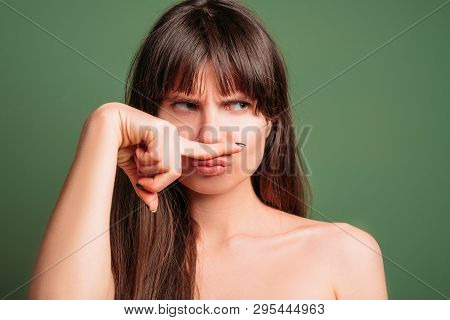 Naughty Beautiful Young Lady. Unhappy Facial Expression. Closeup Portrait Of Emotional Woman With In