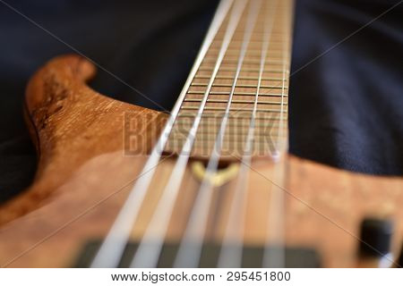 Guitar Strings. The Neck Of Electric Bass Guitar Closeup.