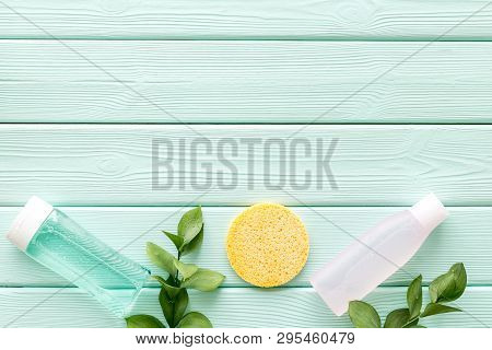 Skin Care Cosmetics With Facial Tonic, Mycelial Water And Sponge On Mint Greem Background Top View M