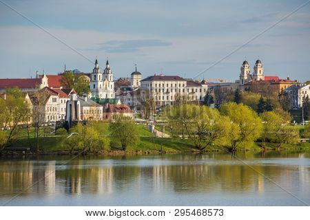 View at island Traetskae Pradmestse (Trinity Suburb) and upper town in Minsk, Belarus. Minsk cityscape in spring, Belarus.