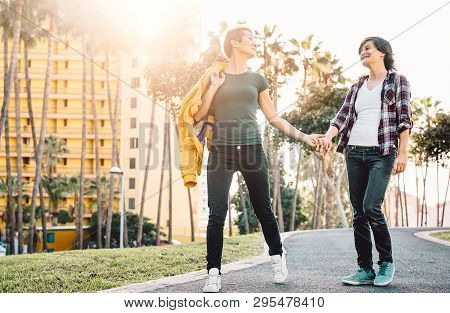 Happy Lesbian Couple Having Fun Dating Outdoor - Young Gay Women Walking And Holding Hands Outside -