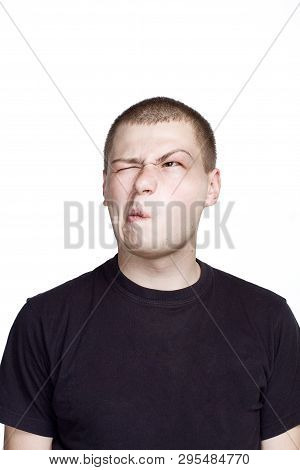 Portrait Of Young Man. Facial Expression. Tasteless Face.