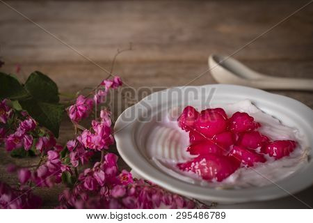Thapthim Krop, Mock Pomegranate Seeds In Coconut And Syrup In The White Bowl On The Wood Table There