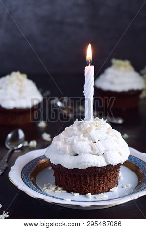 Chocolate Cupcake With Vanilla Cream And Candle. Happy Birthday. Dark Photo.