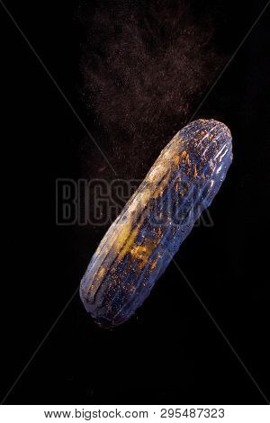 Beautiful Bright Eclair With Blets On A Dark Background.