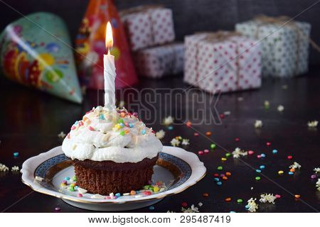 Chocolate Cupcake With Vanilla Cream And Candle. Happy Birthday. Dark Photo.