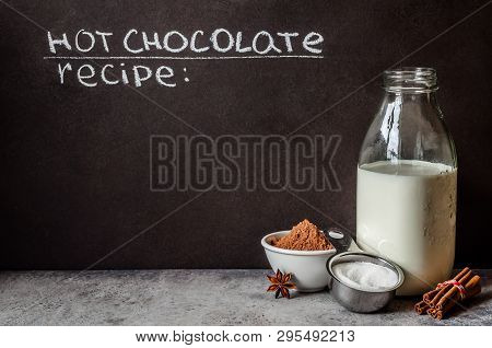 Hot Chocolate Ingredients Near A Blackboard To Whrite The Recipe On, Copy Space For Your Text