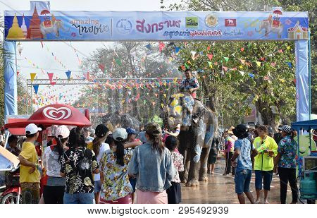 Ayutthaya Thailand April 14, 2019 : Elephant Splashing Water Between Tourist In Songkarn Festival