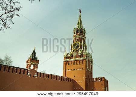 View Of The Kremlins Spasskaya Tower With A Clock And The Kremlin Red Wall In Moscow
