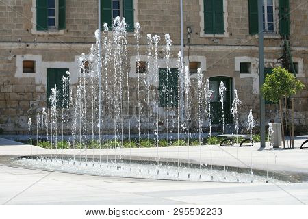 Paphos, Cyprus, April 11th, 2019: Fountain On Kennedy Square In Pano Paphos (ktima) On A Sunny Day