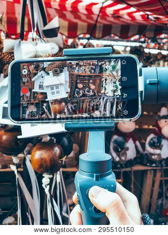 Germany, Nuremberg - December 17, 2018: Close-up Of Man Blogger Hands Shooting Video On Smartphone I