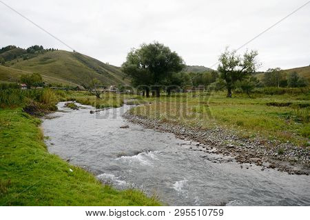 The Mountain River Yarovka In The Village Of Generalka Of The Altai Territory. Western Siberia. Russ