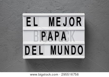 Top View, 'el Mejor Papa Del Mundo' Words On Modern Board Over Concrete Surface. Overhead, From Abov