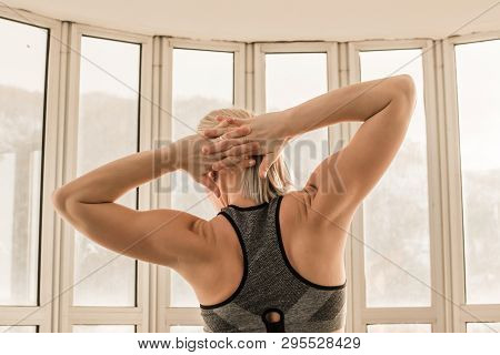 Beautiful Blonde Female Trainer Showing Her Arm And Back Muscels. Healthy, Active Lifestyle, Losing 