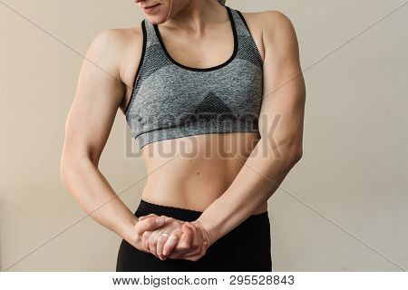 Female Trainer Showing Her Arm Muscels. Healthy, Active Lifestyle, Losing Weight. Women Power