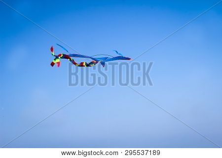 A Kite Rises In Strong Wind In The Baltic Sea Sky