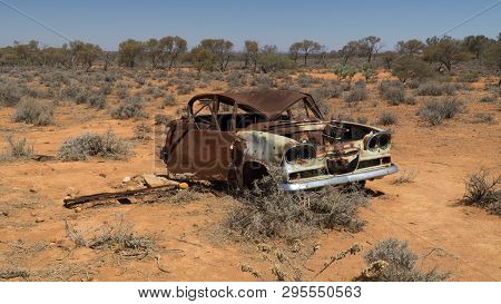 Rusty Wreck Of Crashed Car In The Middle Of Desert (warning To Inattentive Drivers), Stuart Highway,