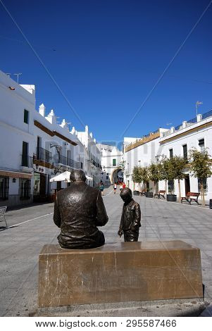 Conil De La Frontera, Spain - September 14, 2008 - Statue Of A Man And Boy In The Plaza De Espana, C