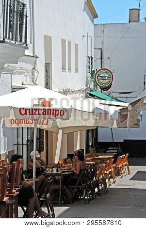 Conil De La Frontera, Spain - September 14, 2008 - Tourists Relaxing At Pavement Cafes In The Old To