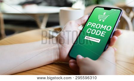 Promo Code Discount Coupon Number Field On Mobile Phone Screen. Business And Marketing Concept.
