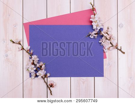 Apricot Branches With Flowers And Candle On A Plate On A Wooden Background