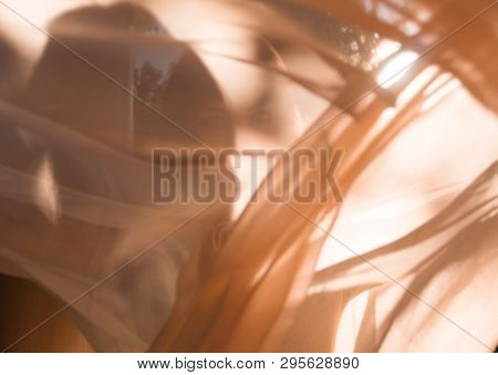 Texture Of Cloak In Sunset Light. Beautiful Moroccan Girl Waving Her White Mantle