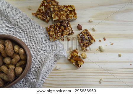 Mole Foot On Wooden Background. The Foot Of A Brat Is A Typical Sweet Of The Brazilian Cuisine, Made