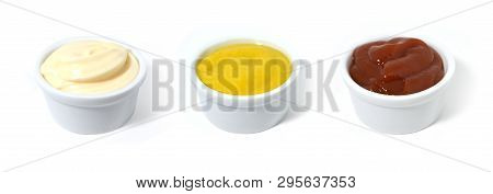 Sauces. Mayonnaise, Catchup And Mustard In Small Porcelain Containers.