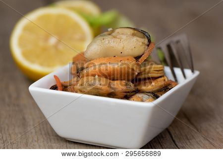 Pickled Mussels With Carrot, Lemon Juice And Oil.