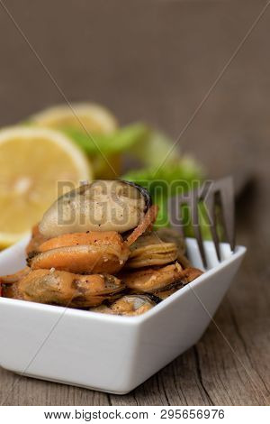 Pickled Mussels With Carrot, Lemon Juice And Oil.